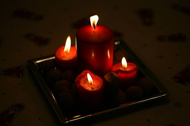 istock Low key shot of four burning candles 186817344