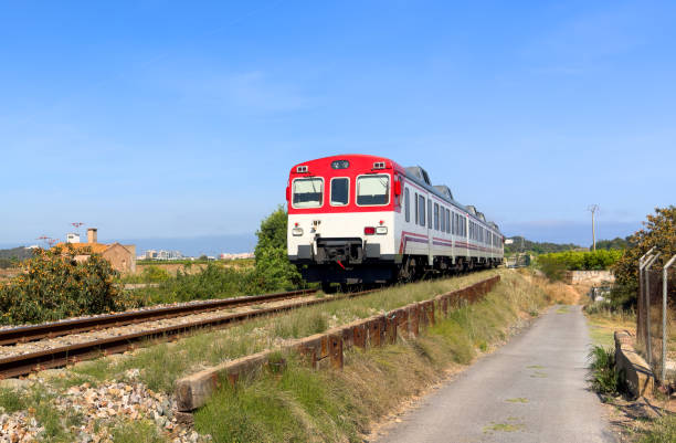 Train on railway. Spain regional commuter train in motion on railway. Spanish National Rail Network. Travel by train in European countries. Train against of mountains drive on railway