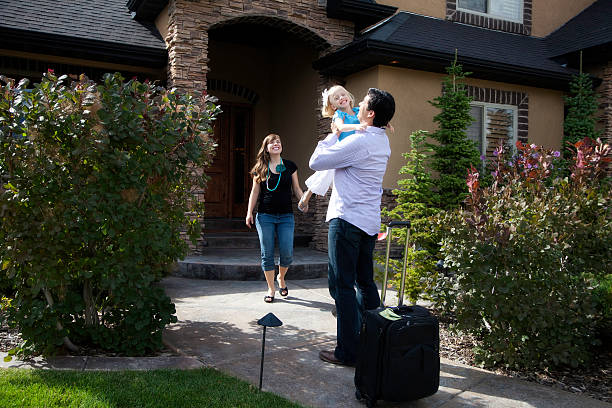 istock Home from a Business Trip- Dad and Daughter Hugging 186817444