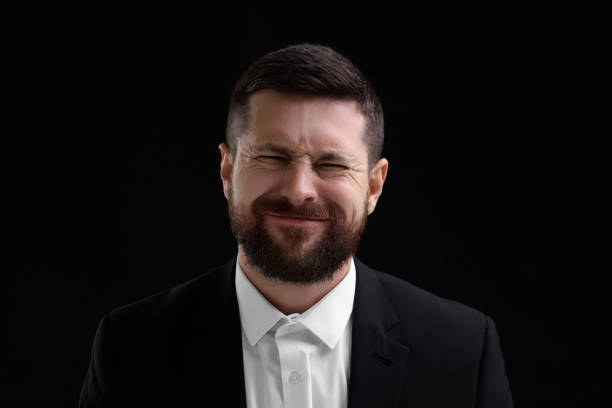 istock Personality concept. Emotional man on black background 1868174898