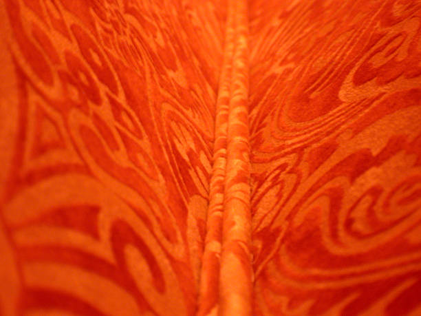 a corner seam - red ornamental fabric stock photo