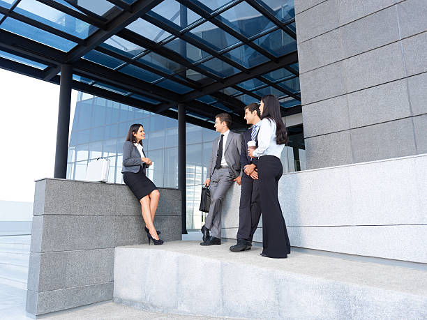istock Business people talking outside office 186817729