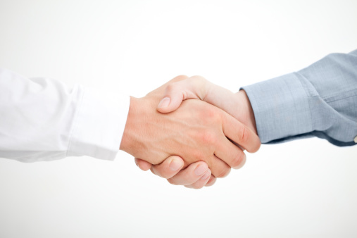 Two businessmen shaking hands. White background.