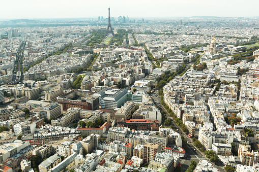 Paris Aerial View with Ecole Militaire, the Champ-de-Mars, the Eiffel Tower, the Bois de Boulogne and the skyscrapers of La Defense (Hauts-de-Seine département municipalities of Nanterre, Courbevoie and Puteaux) in the background.