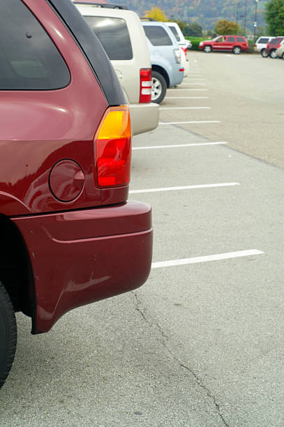 istock cars parked in a parking lot 186818097