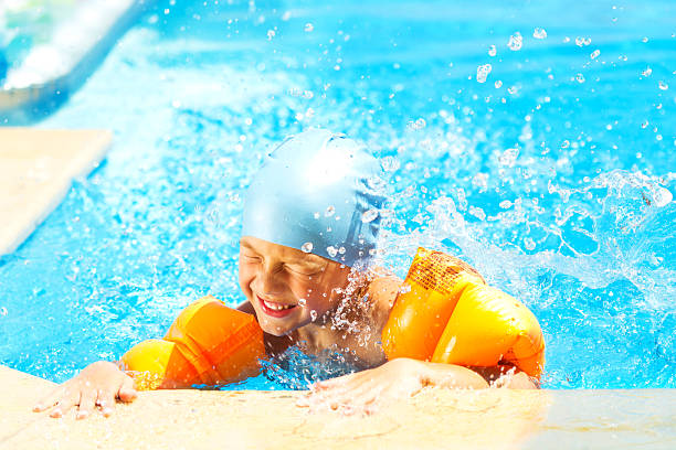 istock Happy Little Boy In The Pool 186818109