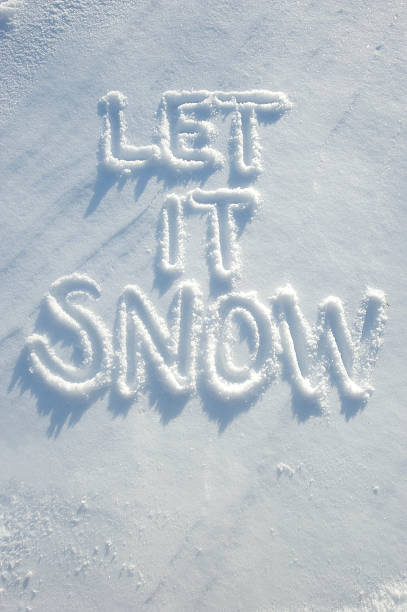 Let It Snow message handwritten in fresh white powdery snow