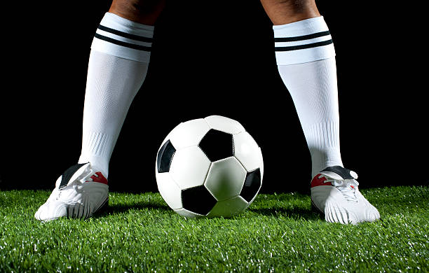 istock Man standing over a soccer ball 186818538