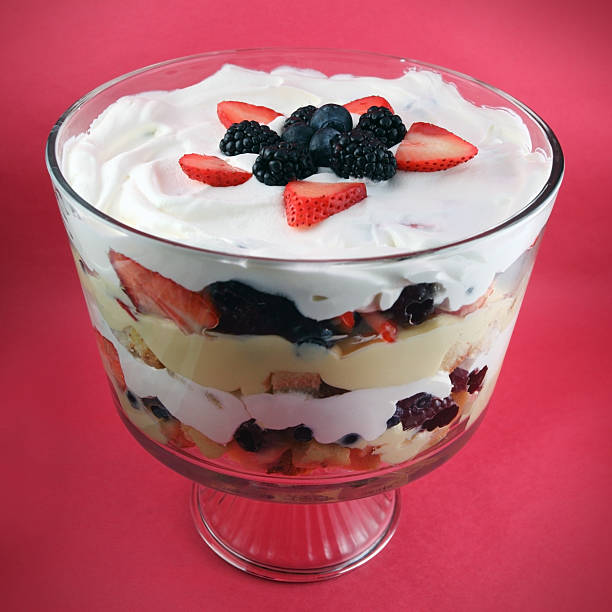 Trifle Dessert Trifle dessert on red background. trifle stock pictures, royalty-free photos & images