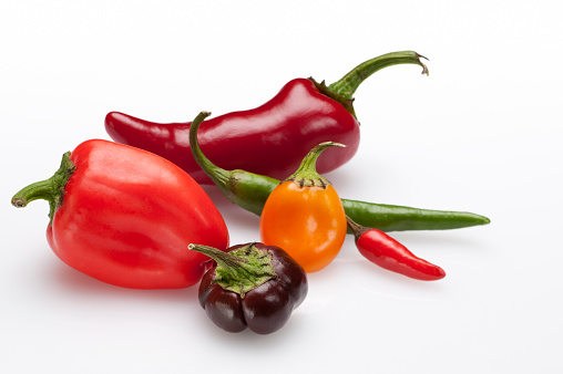 Variety of colorful hot chili peppers with clipping path.