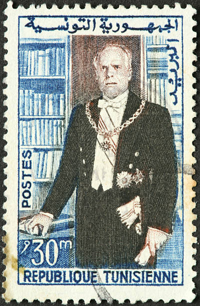 istock formally dressed man on old Tunisian stamp 186818779
