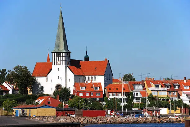 "Picturesque view to the Saint Nicolaj church and skyline of RAnne (Bornholm, Denmark)The church is dedicated to the saint of seafarers and was originally built in 1275."
