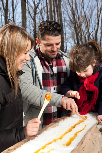 istock Family eating maple taffy 186819107