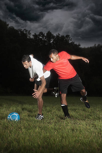 istock Two Football Players Tackle 186819134