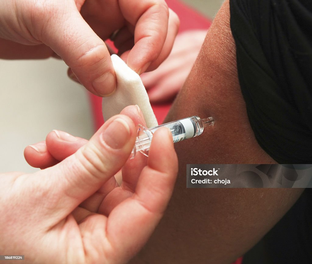 Gripe vaccination.Nurse en el trabajo. - Foto de stock de Asistencia sanitaria y medicina libre de derechos