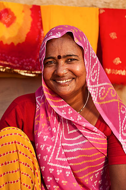 istock Woman selling colorful fabrics 186819435