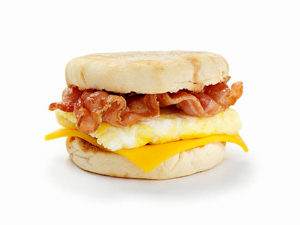 Bacon and Egg Breakfast Sandwich "Bacon, Egg and Cheese Breakfast Sandwich on a Toasted English Muffin with a Natural Drop Shadow- Photographed on Hasselblad H3D2-39mb Camera" continental breakfast photos stock pictures, royalty-free photos & images