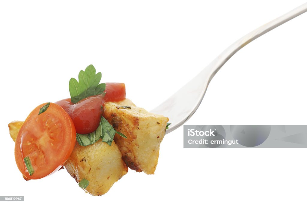 Baked potato with tomato and ketchup on fork isolated. Baked potato with tomato and ketchup on fork isolated.My other similar images Baked Stock Photo