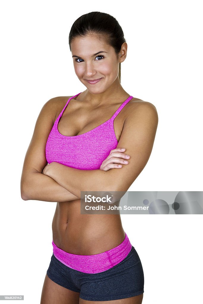 Fit young woman Beautiful young woman in fantastic physical condition wearing fitness clothing and isolated on white background  20-24 Years Stock Photo