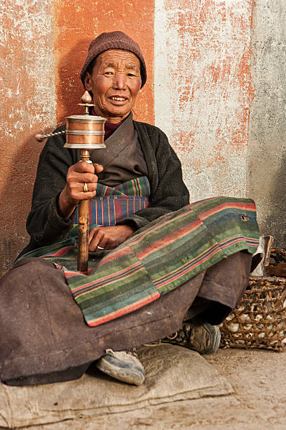 istock Tibetan woman praying, Mustang 186820244