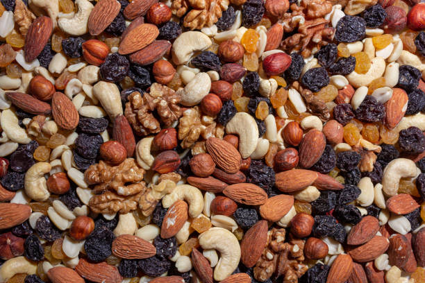 istock Mixed Nuts: Almonds, Walnuts, Cashews, Peanuts, Hazelnuts, Dried Prunes and Raisins 1868202568