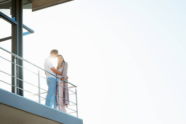 istock Romantic couple standing at balcony 186820456
