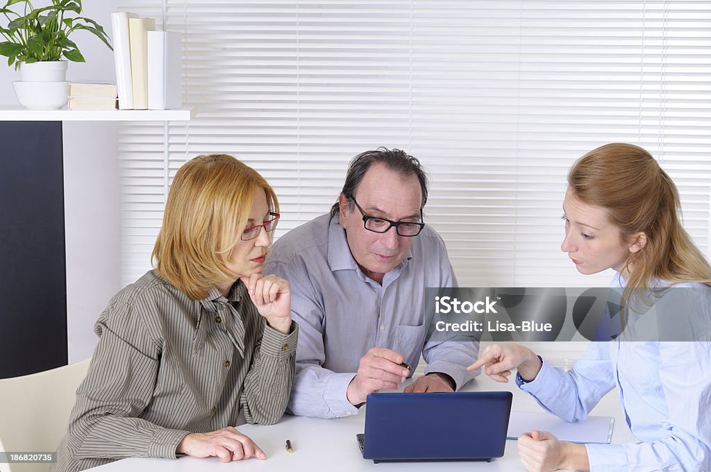 Mature Couple and Financial Advisor "Mature couple and financial advisor,lawyer or counselor" Lawyer Stock Photo