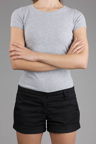 istock Young woman's torso with blank gray shirt 186820772