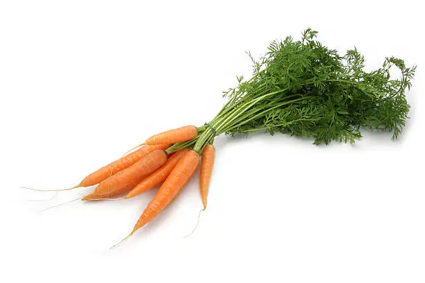 Photo of Bundle of small carrots on white background