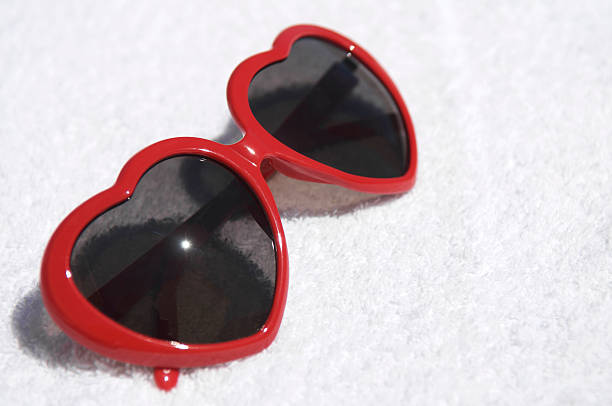 istock Bright Red Heart Sunglasses on White Towel 186820928
