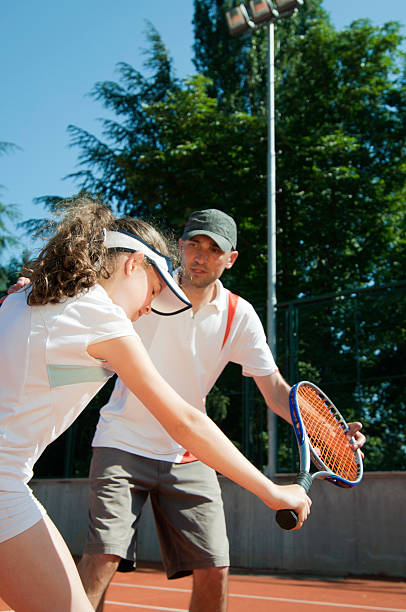 istock Tennis coach with young talent 186821122