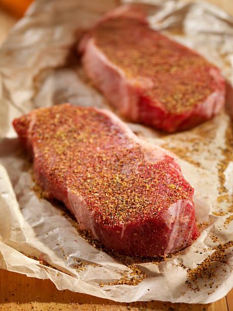 istock Raw Steaks Seasoned in Butcher Paper 186821195