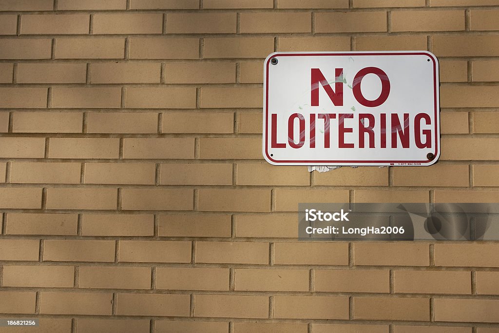 No Loitering A picture of a sign prohibiting loitering. Brick Stock Photo