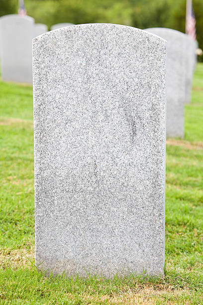 istock Blank Tombstone Grave at a cemetery 186821341