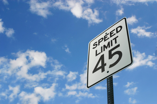 45 MPH speed limit sign against blue sky