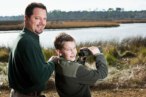 istock Father and son enjoying scenic view 186822219