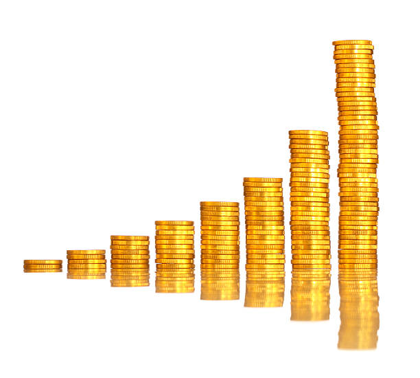 Piles of golden coins in the shape of a graph showing increasing wealth.