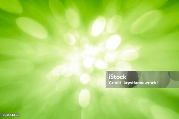 Green Sparkles Coming From The Center Stock Photo - Download Image Now - Abstract, Brightly Lit, Christmas