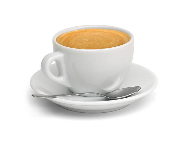 A cup of coffee with a spoon and saucer stock photo