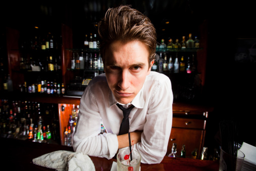 Wide-angle shot of a crazy-looking bartender