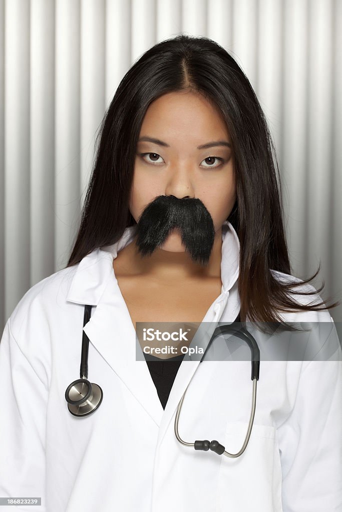 Asian woman with moustache and stethoscope Asian woman with moustache and stethoscope   20-29 Years Stock Photo