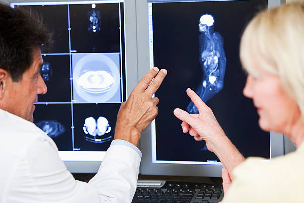 istock Doctor and patient discussing medical scans 186823586