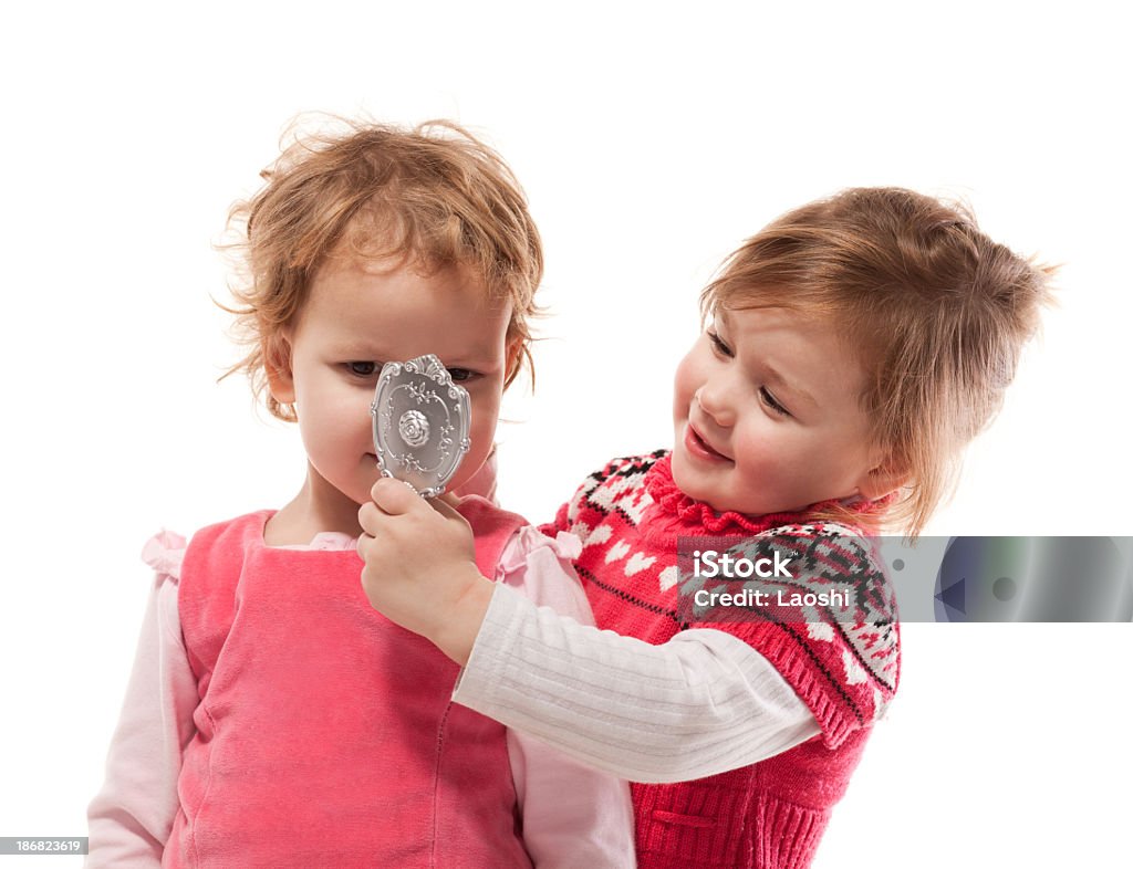 Two young ladies Laughing little girls. Studio shot Looking Stock Photo