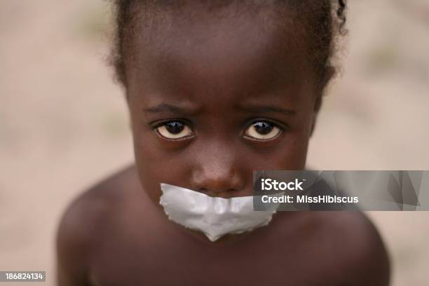 African Girl With Tape On Mouth Stock Photo - Download Image Now - Slavery, Child, Adhesive Tape