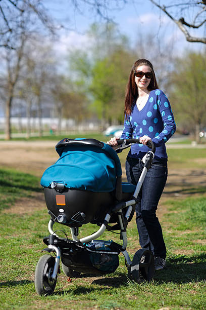 istock Young mother in a park with her baby 186824200