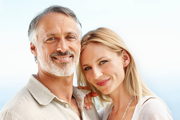 istock Attractive couple smiling together 186824614