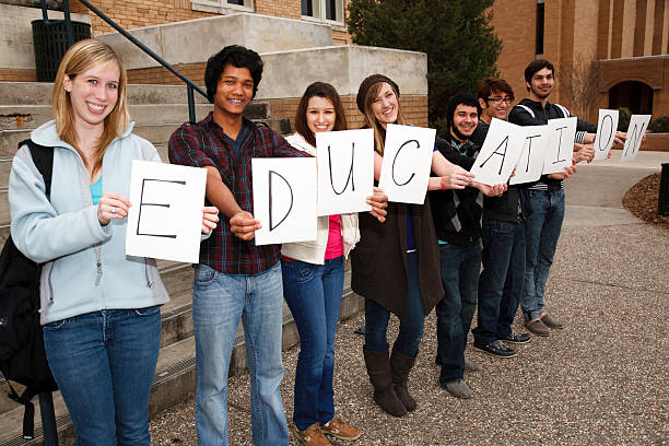 istock Group of College Students Holding Signs Spelling Education 186824761