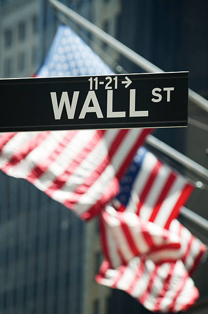 istock Wall Street Sign with American Flags 186825438