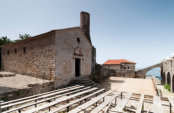 The Church - Mosque The Church - Mosque is unique example of multicultural confessions and religion tolerance in Montenegrin society. This unique structure is the Landmark of Ulcinj's Old town.--- Ulcinj--- multi confession stock pictures, royalty-free photos & images