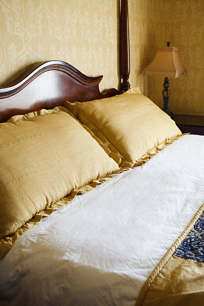 istock Luxury Hotel Room Bed, Pillows, and Lamp 186825490